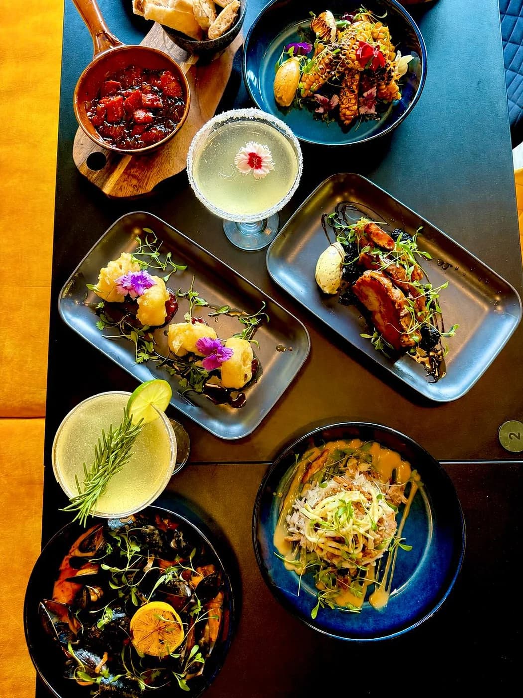 Curated Plates and Cocktails on the Table